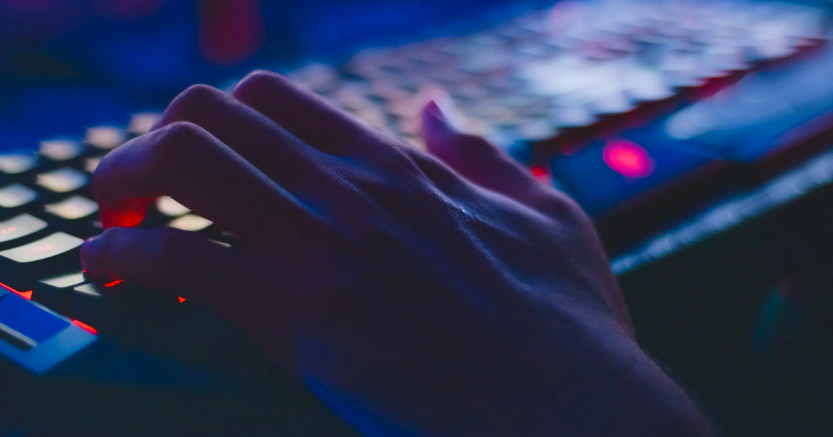 Photo of Person Typing on Computer Keyboard