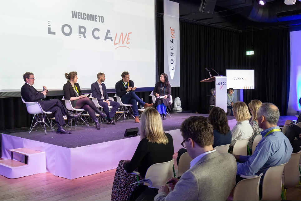 A panel speaker event at a LORCA live event