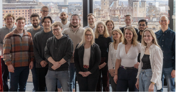 A group of people standing facing the camera
